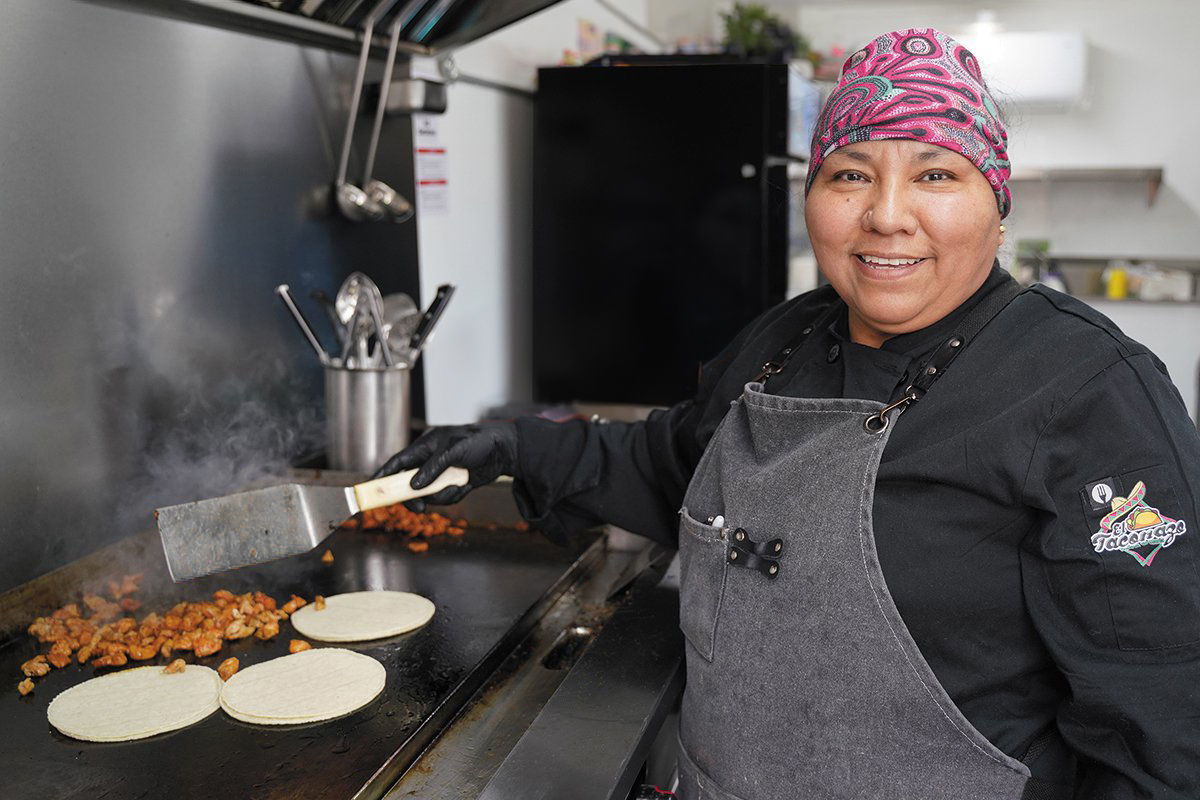 Maria Flores cooking at Taconazo